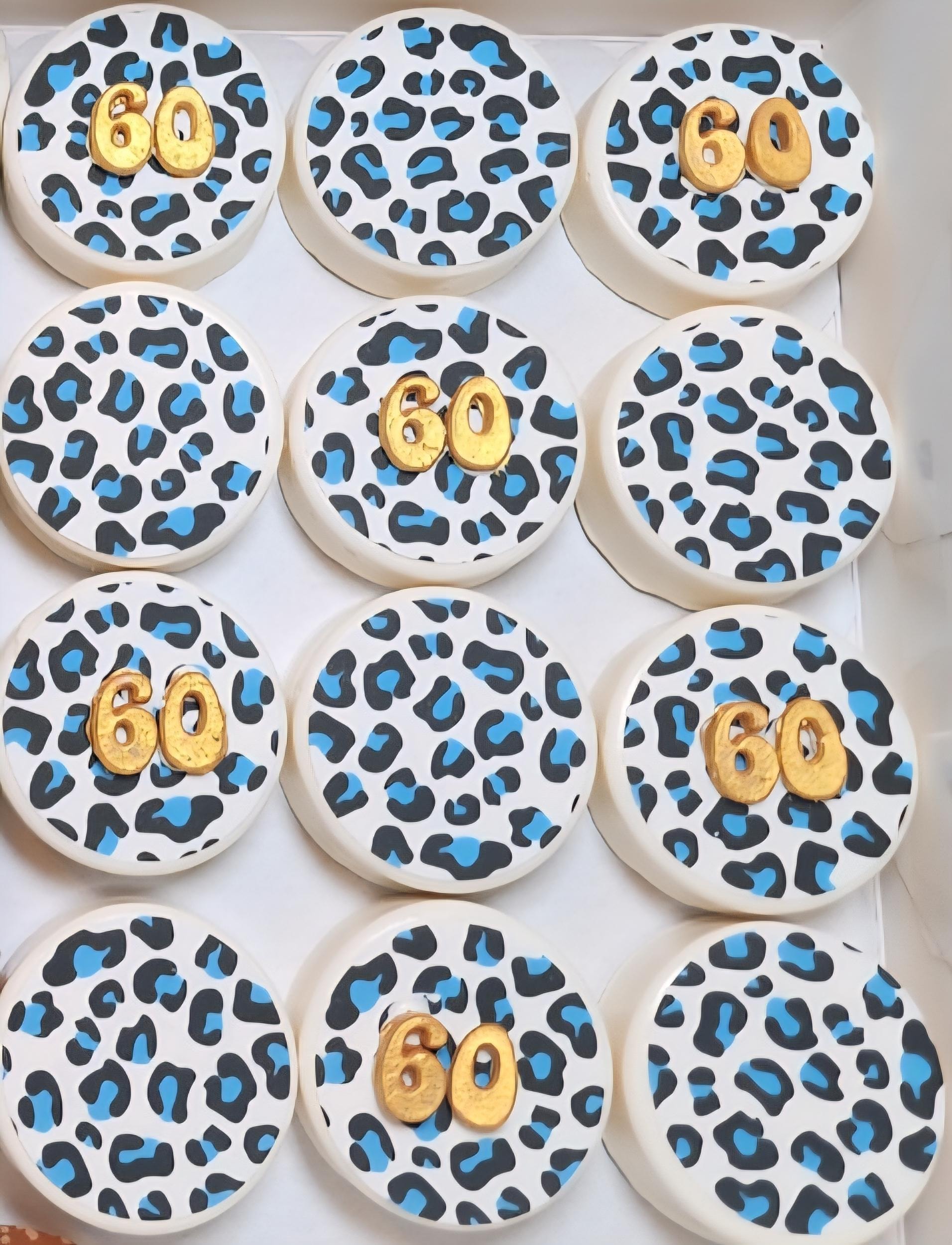 Custom edible image cookies with leopard print design and gold number toppers